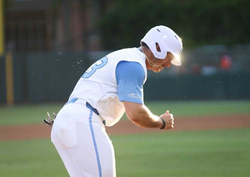 Sophomore designated hitter Alberto Osuna (23) runs towards home base. UNC won 10-4 against FSU at home in the second game of the three-game series on Friday, May 20, 2022.