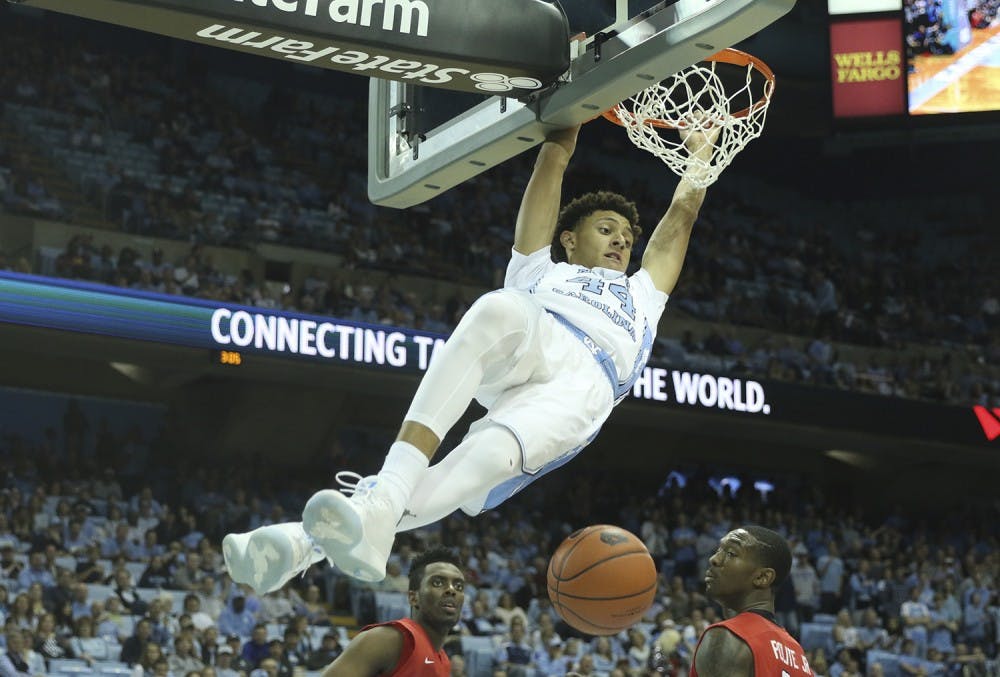 <p>UNC forward&nbsp;Justin Jackson (44) throws down a dunk against Davidson on Dec. 4, 2016. UNC takes on Virginia Tech on Thursday at 8 p.m. in Chapel Hill.</p>