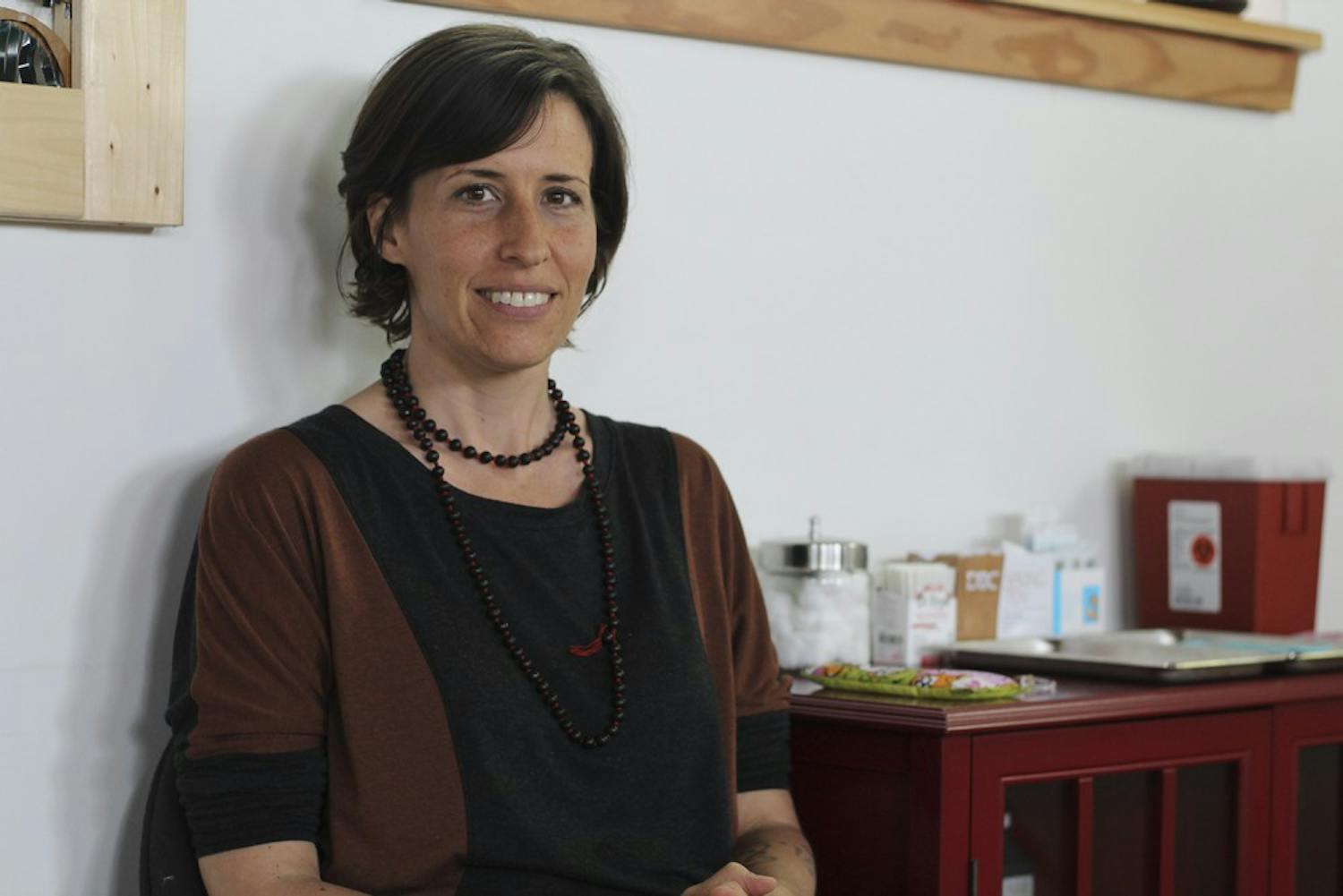 Kim Calandra, owner of Carrboro Community Acupuncture, sits in her office April 22, 2015. Calandra opened it in late 2014, and says she has strived to make the community a big part of the space.