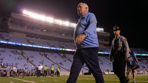 Head coach Mack Brown walks off the field after the game versus Florida A&M at Kenan Stadium n Aug. 27. The Heels won 56-24.