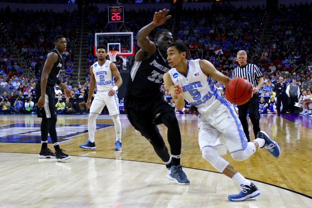 Marcus Paige drives towards the basket. Paige scored 12 points on Saturday night.
