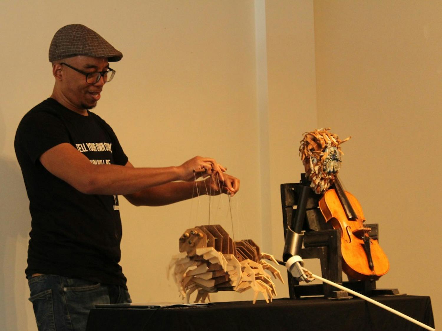 Tarish Pipkins, known as the master puppeteer Jeghetto, performs a puppet show at 109 E Franklin Street on Sunday, April 14, 2019. The pop up art gallery coincides with Arts Everywhere 2019.