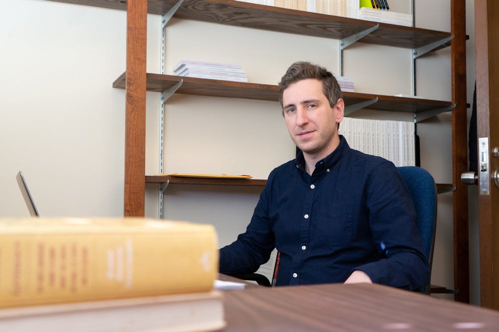<p>Max Lazar, a Jewish Ph.D. candidate in history and a program associate at UNC sits at the desk in his office in Hamilton Hall on Thursday, Jan. 9, 2020. Lazar is wary of listing Jews as a racial group amid the Trump administration's new interpretation of Judaism.&nbsp;</p>