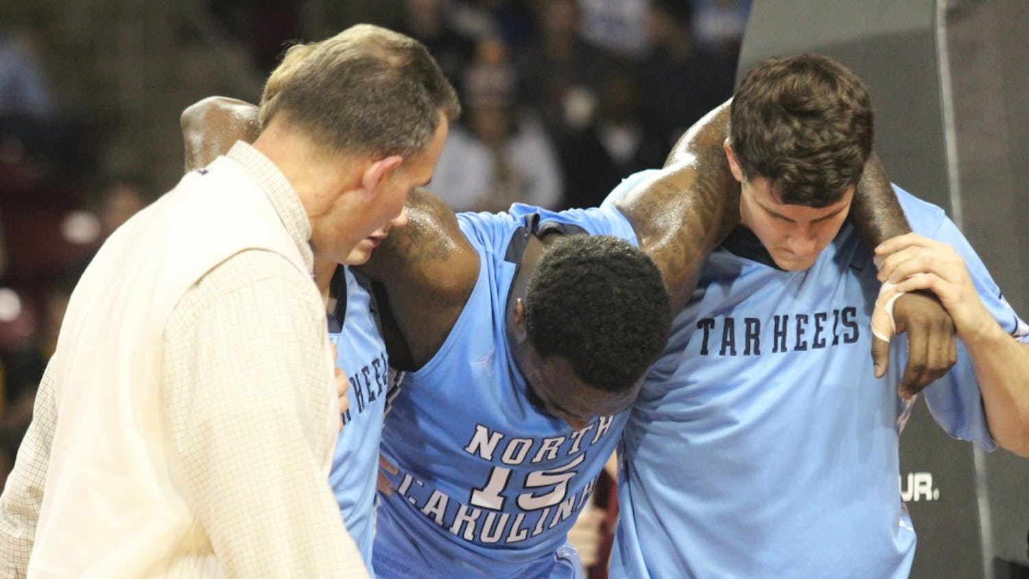 	P.J. Hairston leaves the court after his injury.