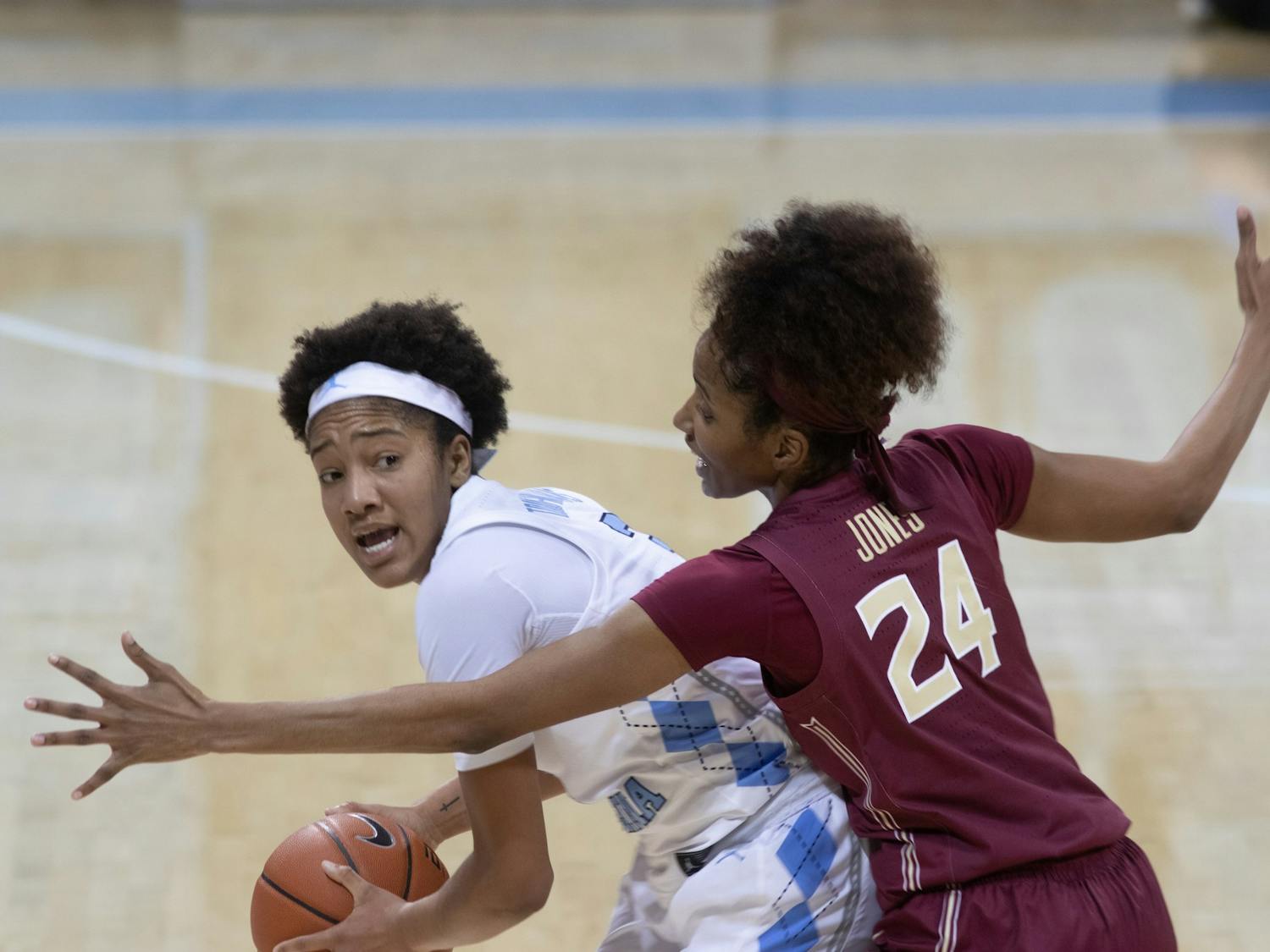 UNC freshman guard Kennedy Todd-Williams (3)  looks to pass the ball against Florida State junior guard Morgan Jones (24) on Thursday, Feb. 4, 2021. UNC fell to Florida State 61-51