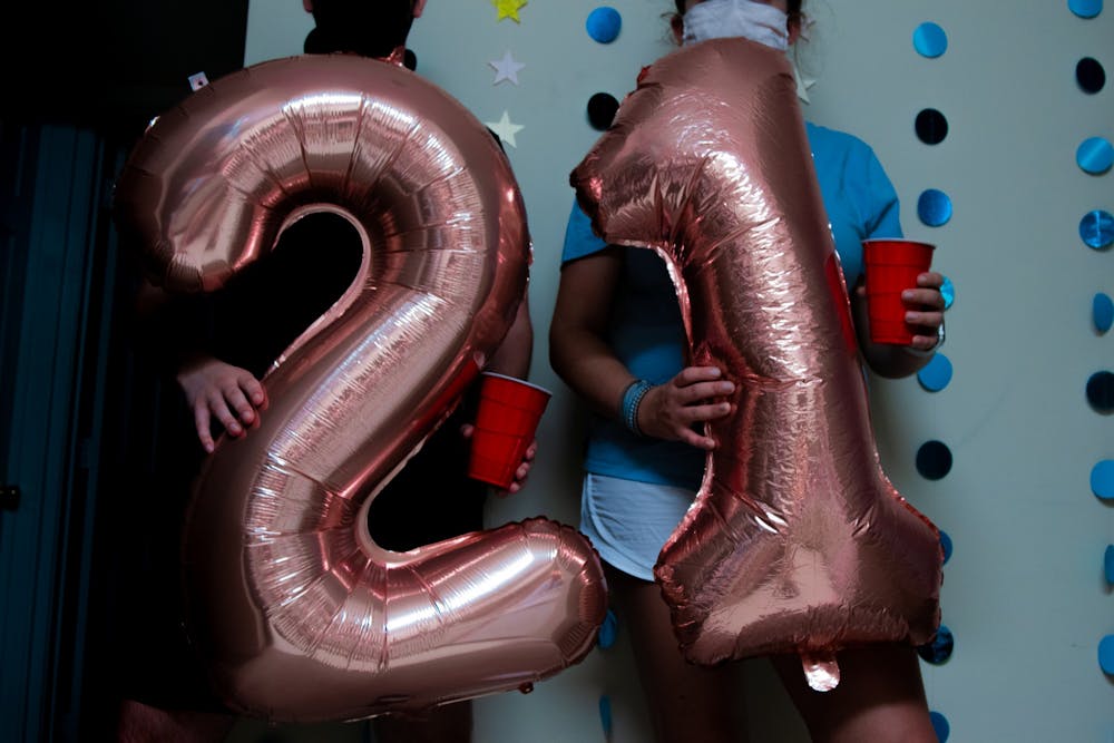 <p>DTH Photo Illustration. COVID-19 has posed many challenges for those turning 21 and wanting to enjoy that rite-of-passage party.</p>