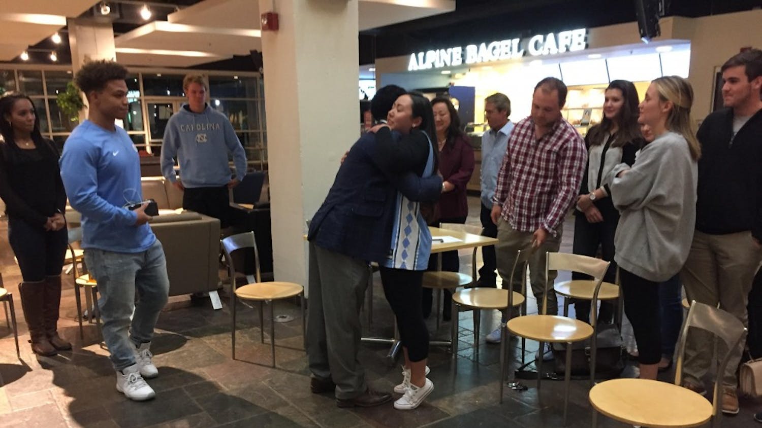 Maurice Grier and Elizabeth Adkins embrace in the Student Union after Adkins was declared student body president on Friday night.&nbsp;