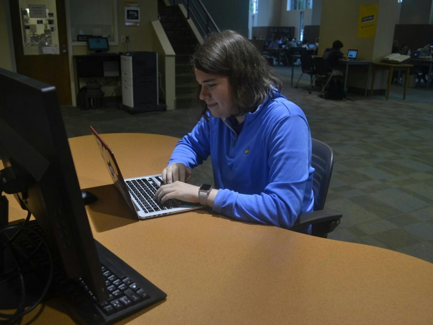 Gabi Stein, a senior computer science major, conducts research for "UNC Project China" in Davis Library. 