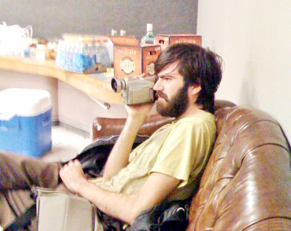 Patrick Stickles, singer of Titus Andronicus, chills in a green room, camera in hand. Courtesy of Titus Andronicus