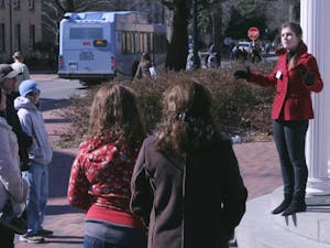 UNC student Ellen Porter leads a tour of the campus for prospective students and their families on Thursday morning. 