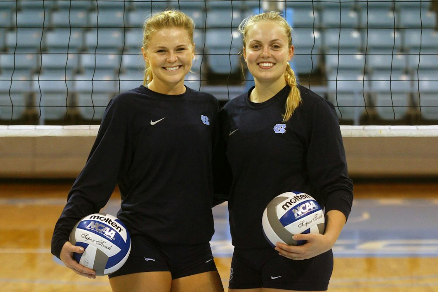 Jordyn Schnabl and Abigail Curry pose for a photo after practice Wednesday night.