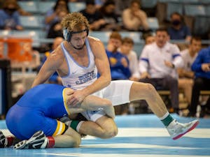Redshirt senior Zach Sherman tries to free himself from a hold during the Tar Heel's match against Pittsburgh on Feb. 4th, 2022 at Carmichael Arena. UNC won 19-12.