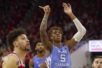First-year center Armando Bacot (5) shoots the ball during the game against N.C. State in PNC Arena on Monday, Jan. 27, 2020. UNC defeated State for the seventh time consecutively 75-65.