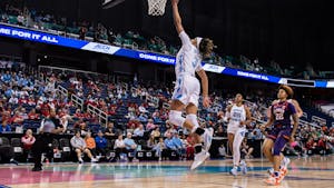 Junior guard Kennedy Todd-Williams (3) goes for a lay-up in the UNC women's basketball team's game against Clemson University in the second round of ACC Championship in Greensboro, NC. UNC won 68-58.