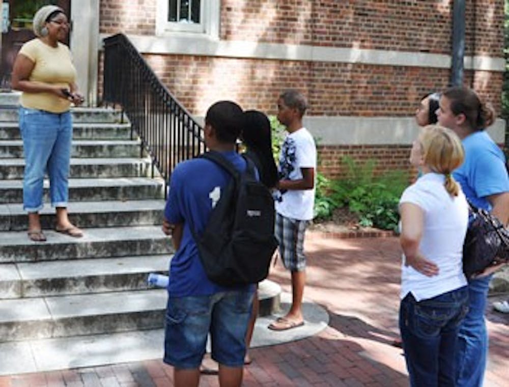 Junior Taylor Beckham, a classical civilizations major, guides a tour group of prospective students and parents around UNC.