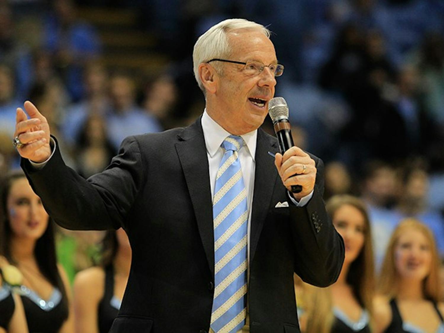 Coach Roy Williams congratulated the seniors after the Tar Heels beat the Fighting Irish 63-61 Monday. 