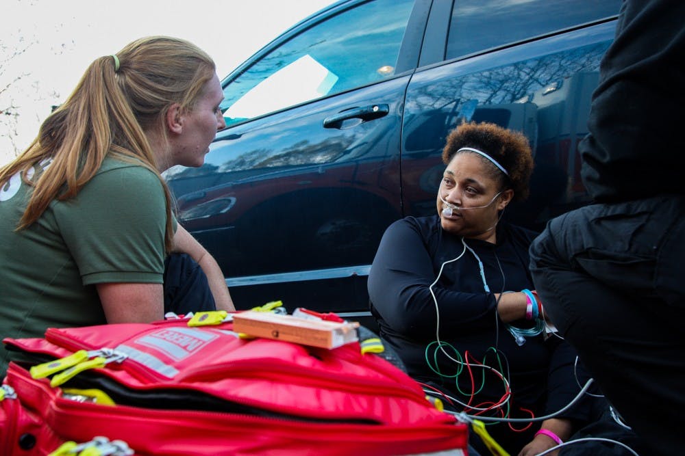 Orange County Emergency Medical Services paramedic Glynis Todman acts as the patient in an opioid overdose response simulation on Monday, Nov. 11, 2019.