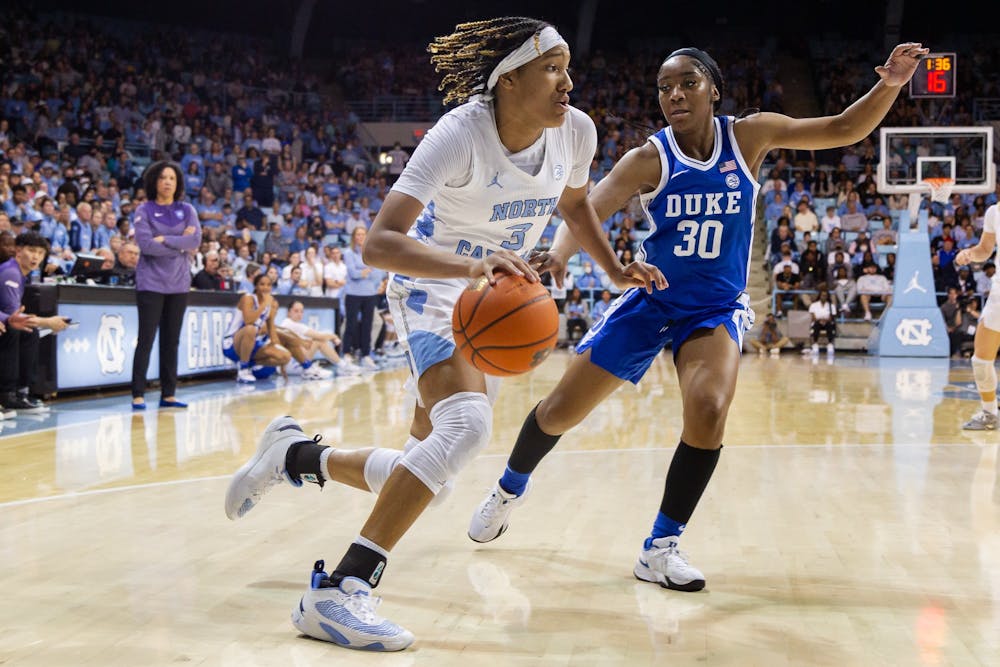 UNC junior guard Kennedy Todd-Williams (3) drives to the basket during the women’s basketball game against Duke on Thursday, Jan. 19, 2023, at Carmichael Arena. UNC beat Duke 61-56.