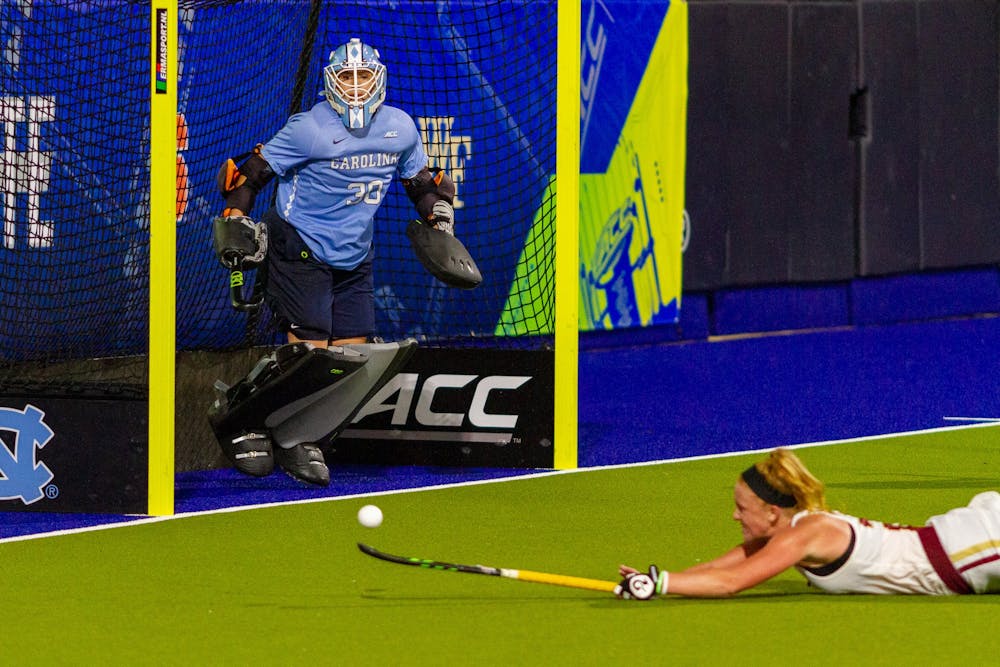 UNC senior goalkeeper Amanda Hendry (30) stands in the goal as Boston College sophomore forward Margo Carlin (24) attempts to save the ball in Karen Shelton Stadium Nov. 5, 2020. The Tar Heels beat the Eagles 4-0 in the first round of the ACC playoffs, securing head coach Karen Shelton’s 700th win.