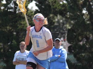 	Junior midfielder Laura Zimmerman attacks the Georgetown defense on Saturday. She rang up four goals on seven shots while chipping in an assist for the Tar Heels in the win.
