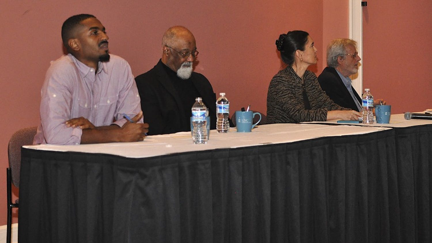 From left, Ori Burton, Irving Joyner, Anita Earls and Al McSurely participated in Thursday night's 50 Years After the Dream: Race and the Justice System Panel.
