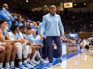 Head coach of the North Carolina Men's Basketball team Hubert Davis yells to his team at the game against Duke at Cameron Stadium on March 5, 2022. UNC won 94-81.
