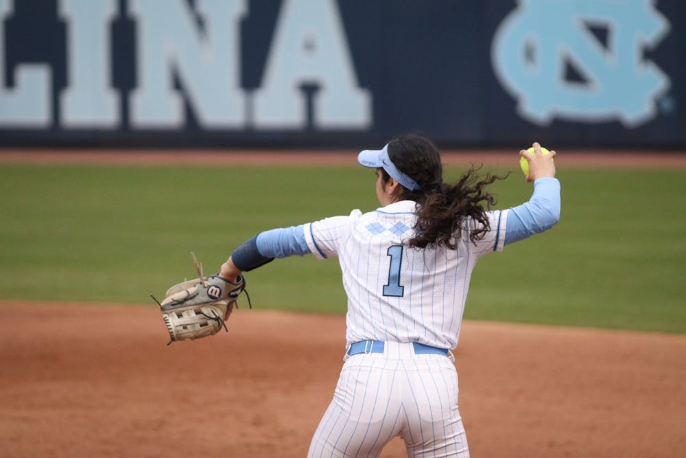 First baseman Kiersten Licea (1) gets ready to throw the ball back to the pitcher's mound during a home game against UNCW. The Heels won 2-0 on Tuesday, March 15, 2022.