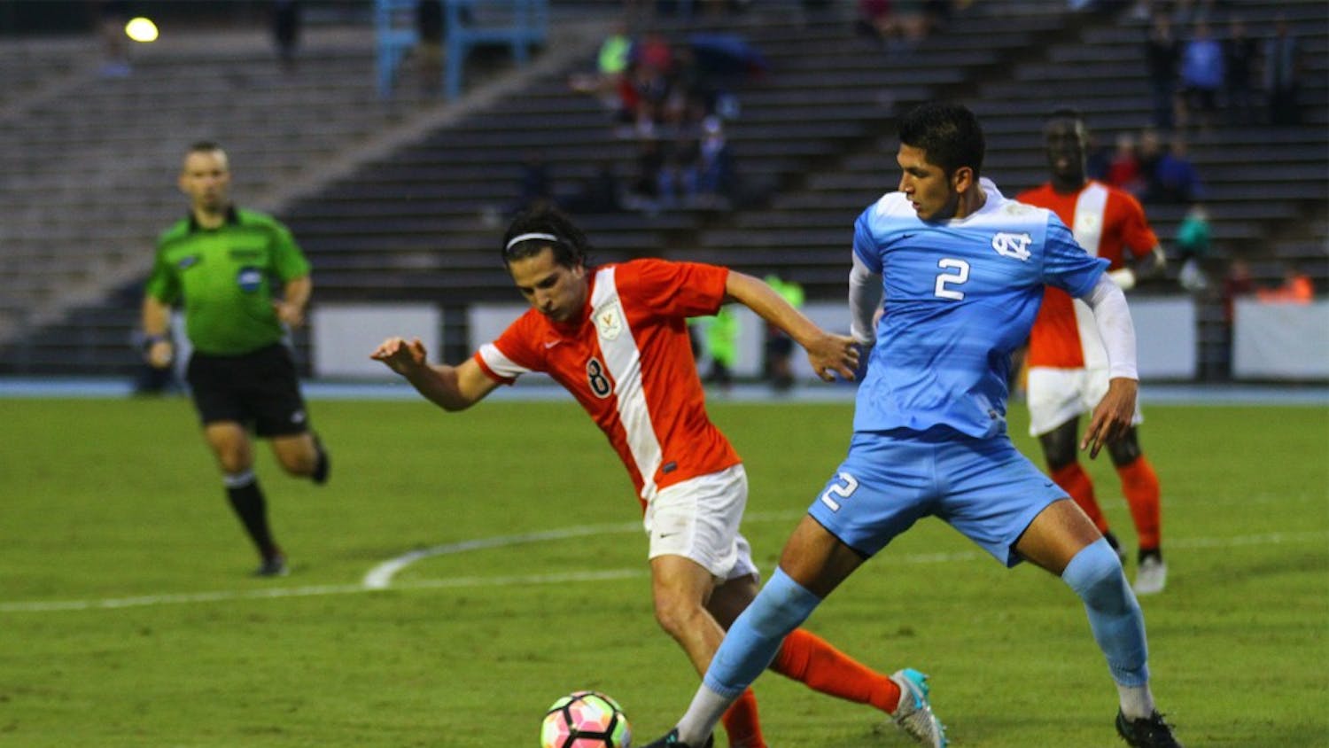 Carolina defender Mauricio Pineda battles for possession of the ball with UVA midfielder Pablo Aquilar.  