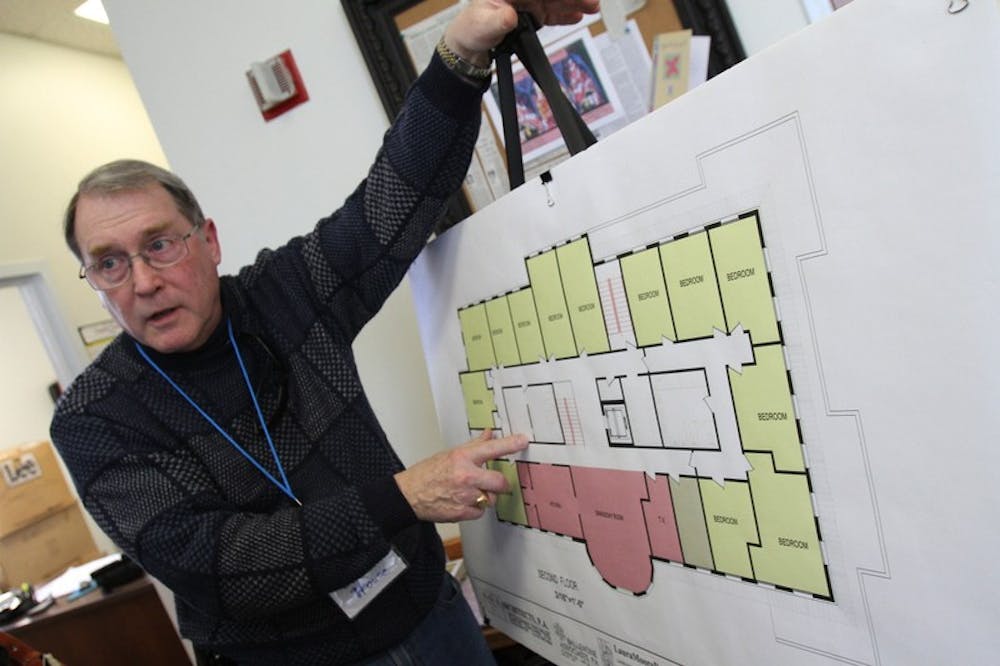 	<p>During a Sunday open house, Charles House, board member on the Inter-Faith Council, explains how living arrangements will be set up at a planned new community center.</p>