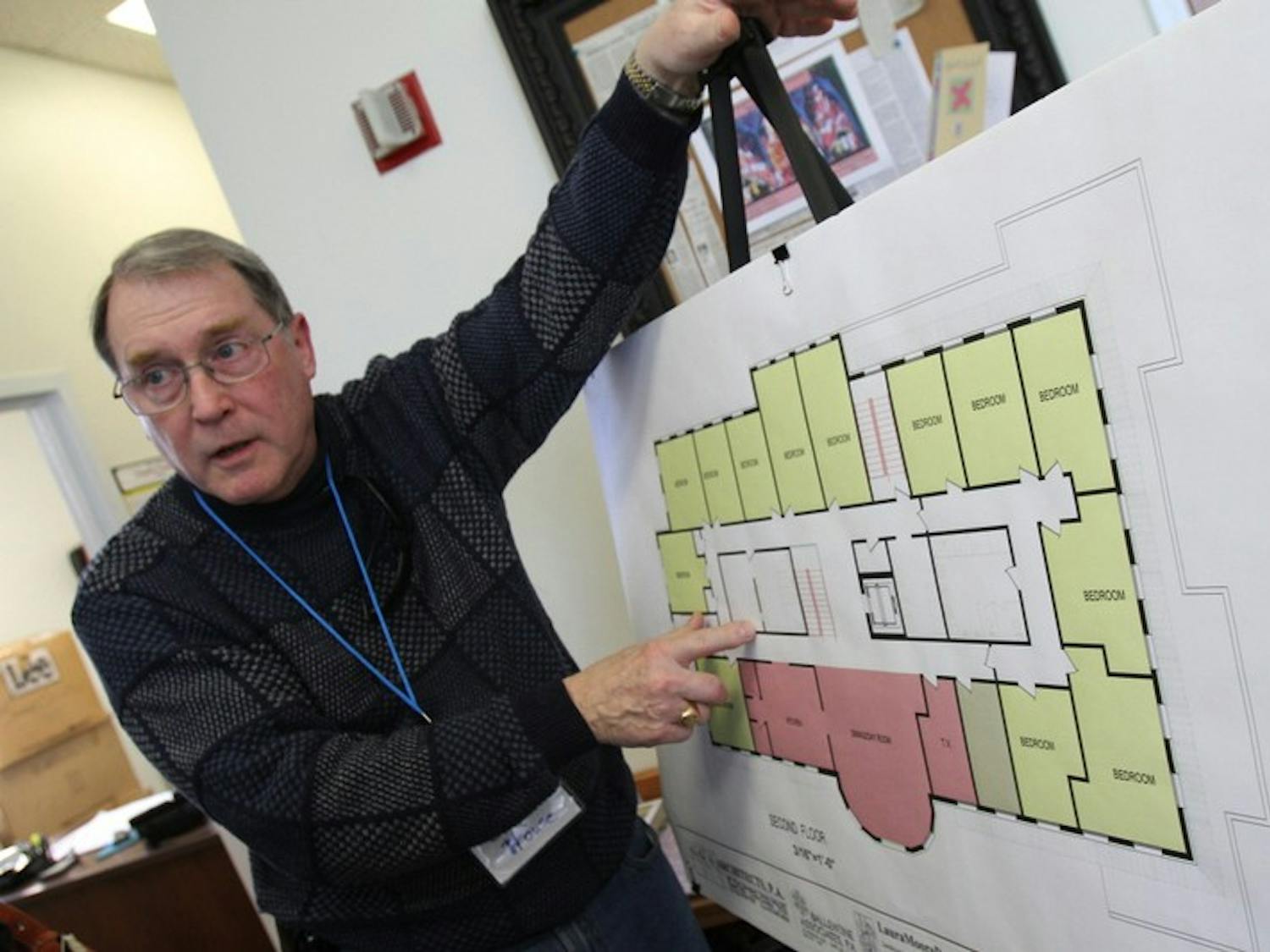 	During a Sunday open house, Charles House, board member on the Inter-Faith Council, explains how living arrangements will be set up at a planned new community center.