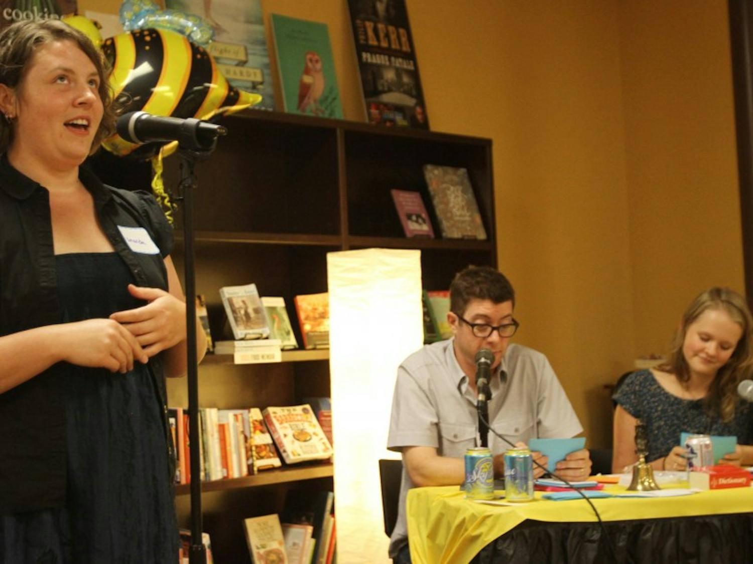 	Amanda Smith spells a difficult word at the Adult Spelling Bee at Flyleaf Books. 