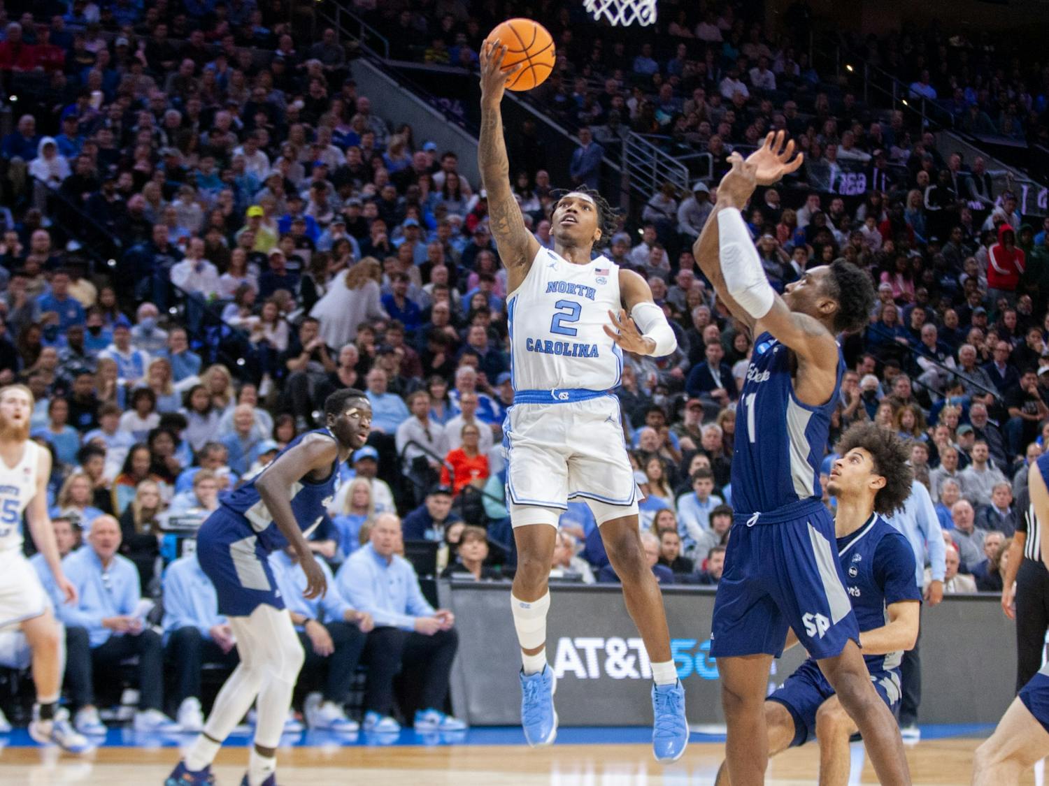 Sophomore guard Caleb Love (2) makes a layup at the Elite 8 game of the NCAA tournament against St. Peter's at the Wells Fargo Center in Philadelphia. UNC won 69-49 and is advancing to the Final Four. &nbsp;&nbsp;