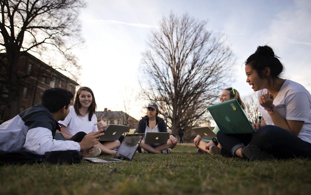 Students gather outside during a warm March afternoon on the lawns of Polk Place on the campus of the University of North Carolina at Chapel Hill.  March 8, 2016.

(Photo by Jon Gardiner/UNC-Chapel Hill)