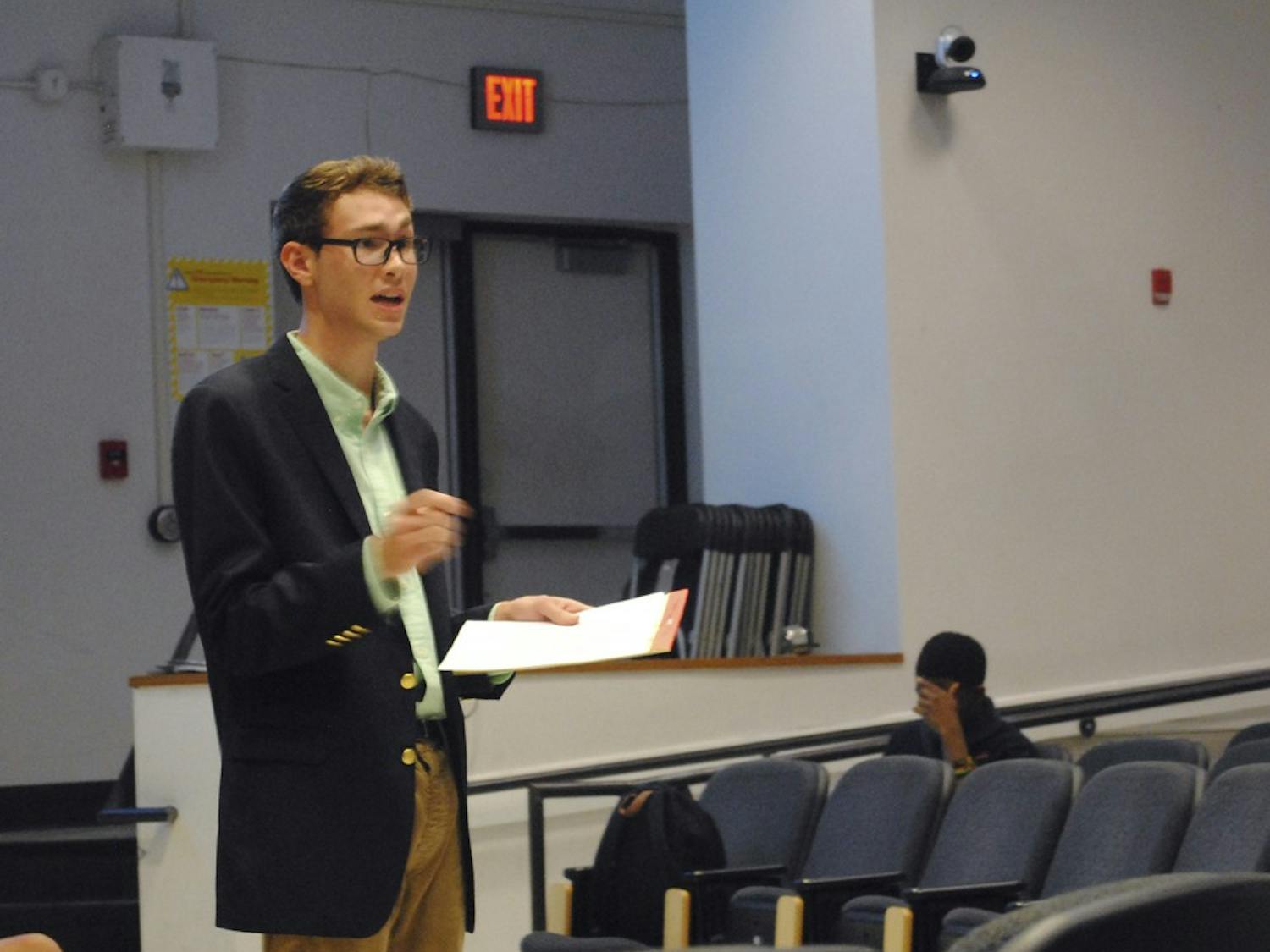 Graham Lowder, member of the Young Democrats, participates in a debate against the College Republicans on Wednesday. The teams discussed issues including climate change, immigration, and higher education. 