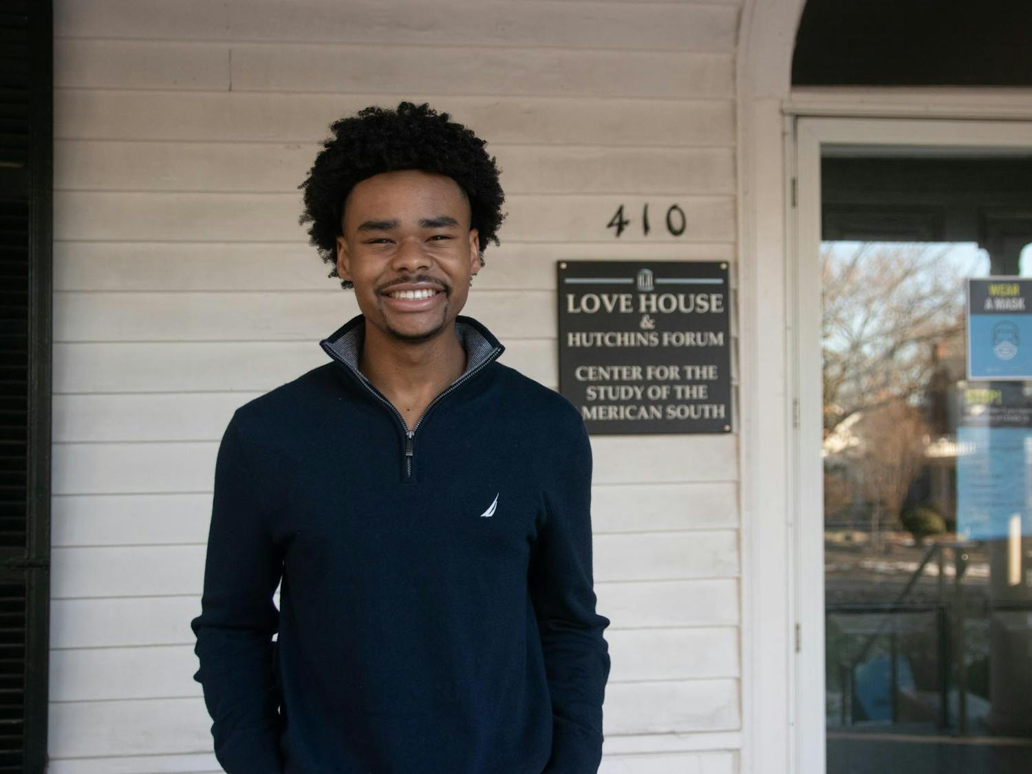 UNC sophomore Shamar Wilson poses for a portrait on Tuesday, Jan. 18, 2022, outside The Love House and Hutchins Forum in Chapel Hill. Wilson is an intern for The Southern Oral History Program, a program dedicated to collecting interviews from Southerners for archival purposes.