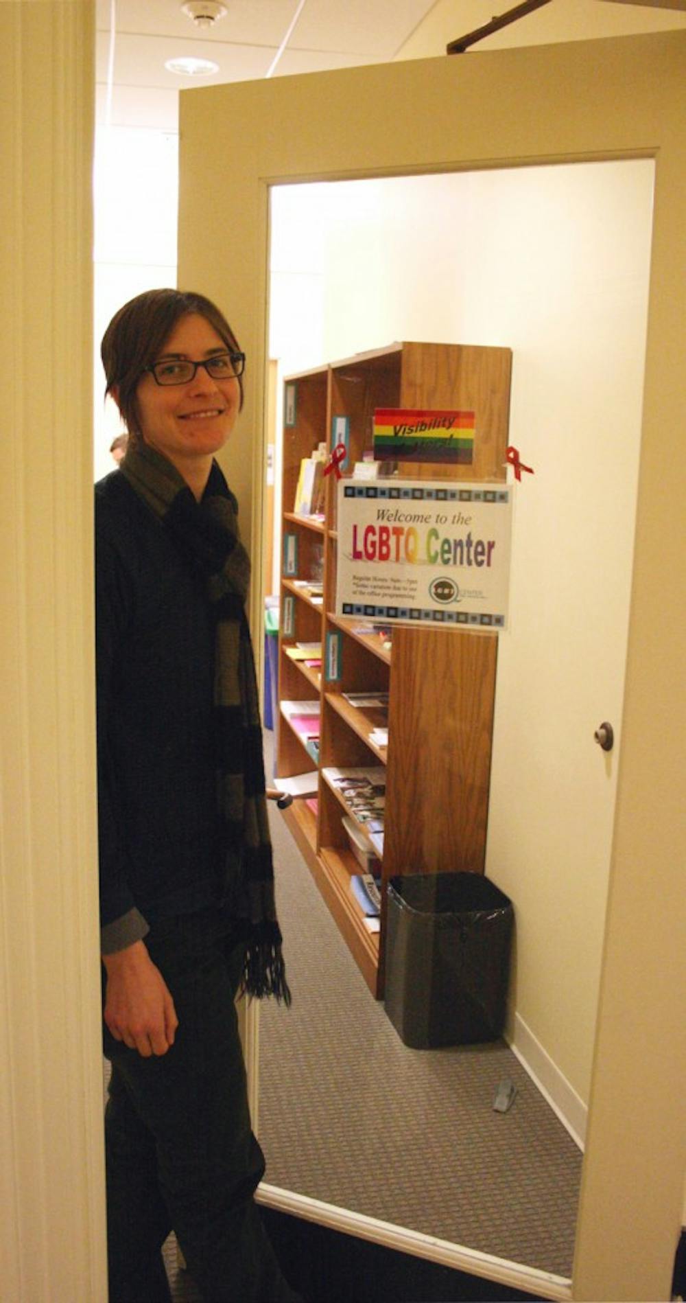 Danny DePuy, assistant director of the Lesbian, Gay, Bisexual, Transgender and Queer Center, stands at its door.  She thinks there needs to be more education about cyber bullying effects.