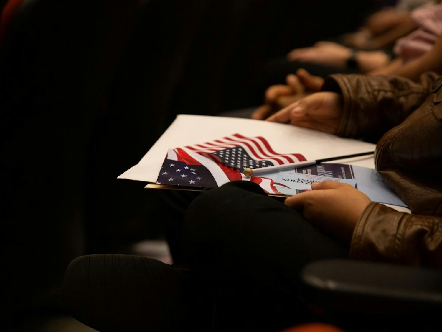 New citizens are sworn in on April 12, 2019 at the FedEx Global Education Center during a naturalization ceremony.