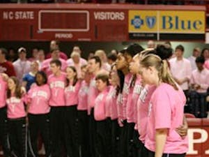 The 2008-09 North Carolina State University women?s basketball team players" coaches and other mourners sing the N.C. State alma mater in remembrance of coach Kay Yow in Reynolds Coliseum Wednesday. Hall-of-fame coach Yow died Saturday after a long fight against cancer.