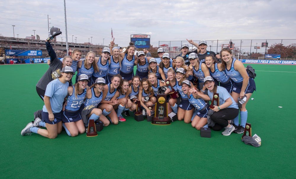 <p>The North Carolina field hockey team poses with the National Championship trophy following a 2-0 win over Maryland at Trager Stadium in Louisville, Ky. Photo courtesy of Jeffrey A. Camarati.</p>