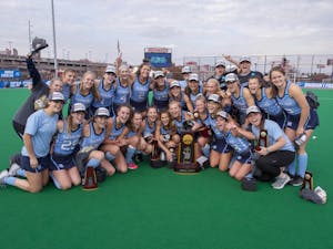 The North Carolina field hockey team poses with the National Championship trophy following a 2-0 win over Maryland at Trager Stadium in Louisville, Ky. Photo courtesy of Jeffrey A. Camarati.