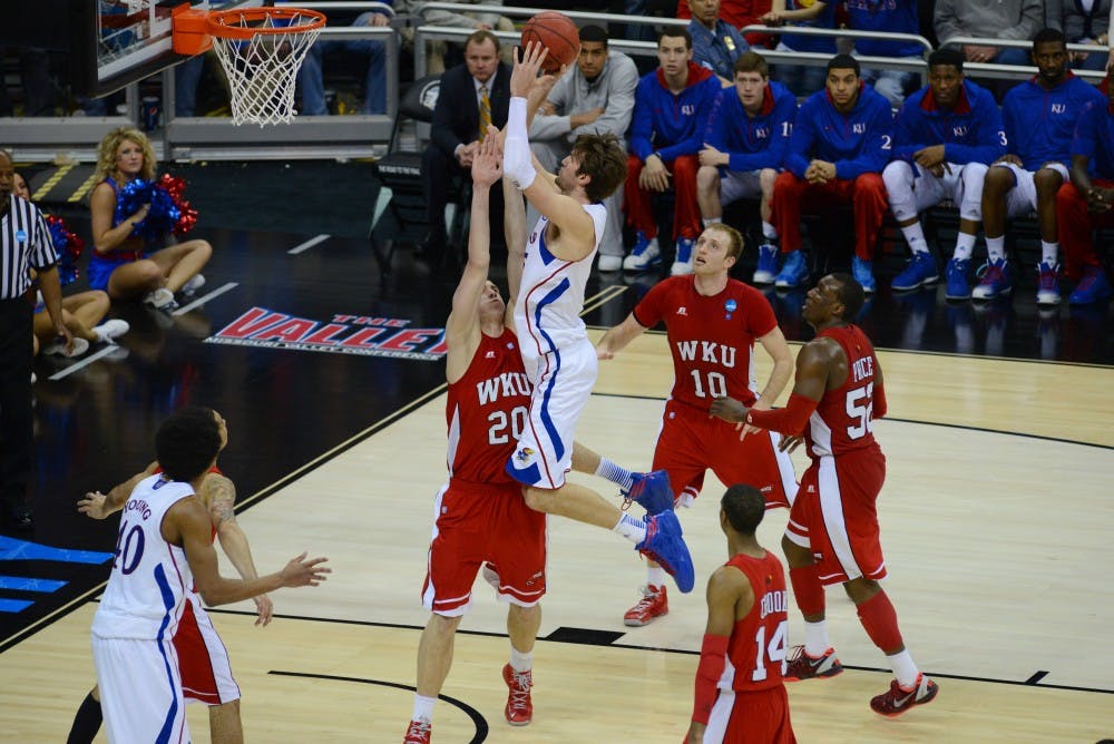 	Kansas center Jeff Withey (5) takes a shot over Western Kentucky forward Aleksejs Rostov (20) in the 2nd round of the 2013 NCAA Tournament on March 22nd, 2013 at the Sprint Center in Kansas City, Missouri. Withey had 17 points, 7 blocked shots, and 6 rebounds in the game.