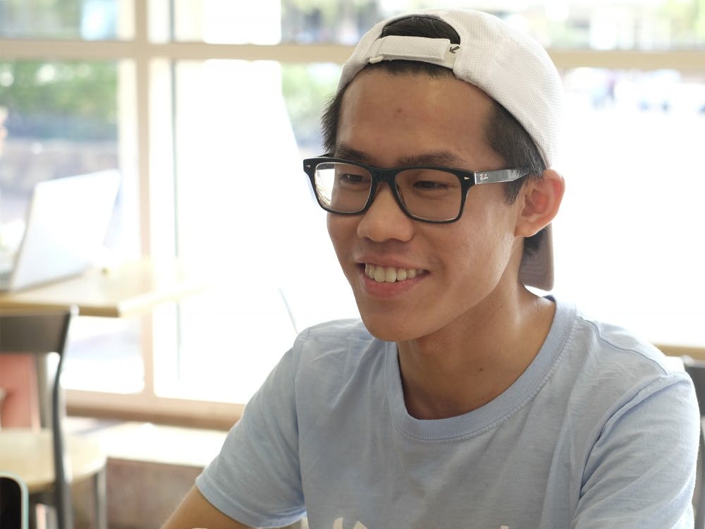 Murphy Liu poses for picture during an interview with Karli Krasnipol at Alpine Bagel. Liu has answered questions posted by other students on facebook.