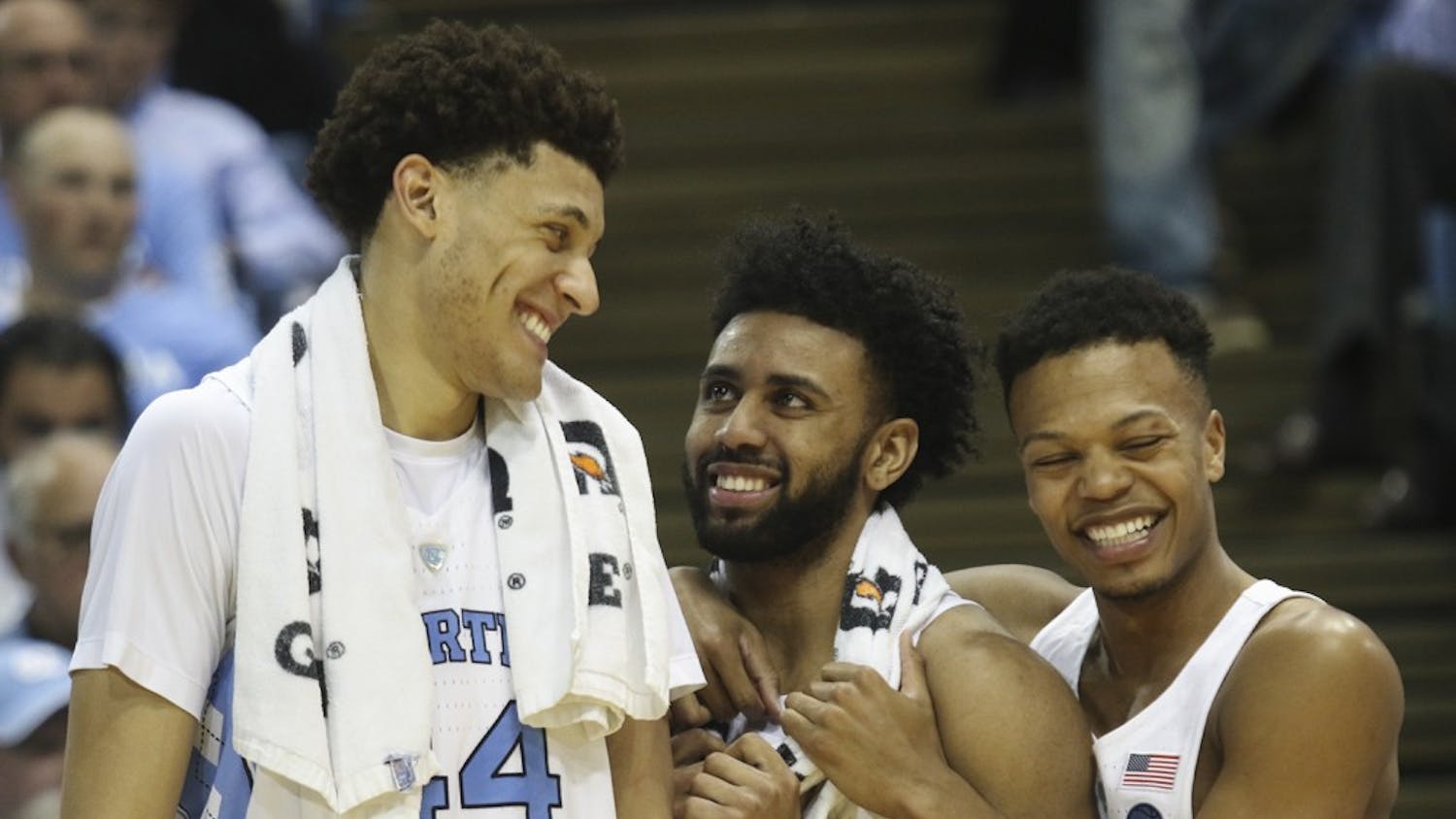 North Carolina teammates Justin Jackson (44), Joel Berry (2) and Nate Britt (0) share a laugh after defeating Duke in the Smith Center on Saturday.