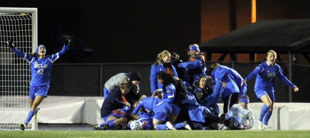 	<p><span class="caps">UCLA</span> women&#8217;s soccer celebrates after a second overtime victory over the Tar Heels. The Bruins won 1-0.</p>