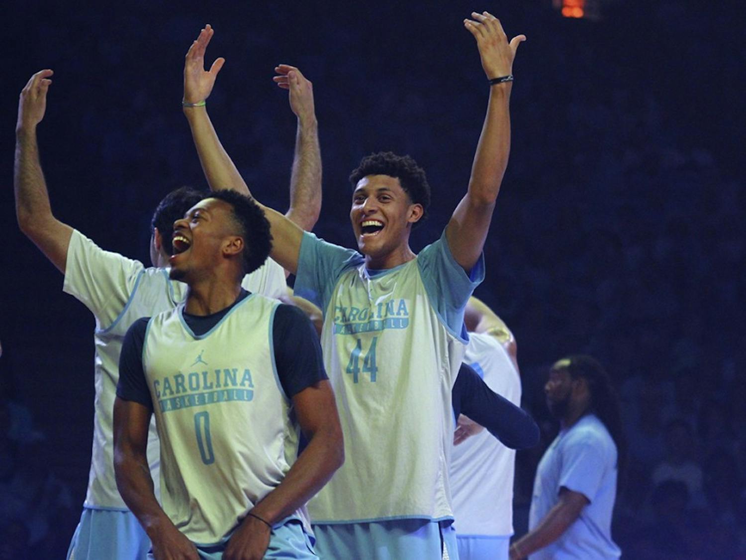 Nate Britt (0) and Justin Jackson (44) hype up the crowd at Late Night With Roy on Friday night.