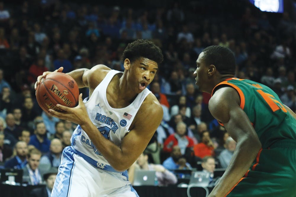 North Carolina forward Isaiah Hicks (4) works on a Miami defender in the quarterfinals of the ACC Tournament in Brooklyn on Thursday.