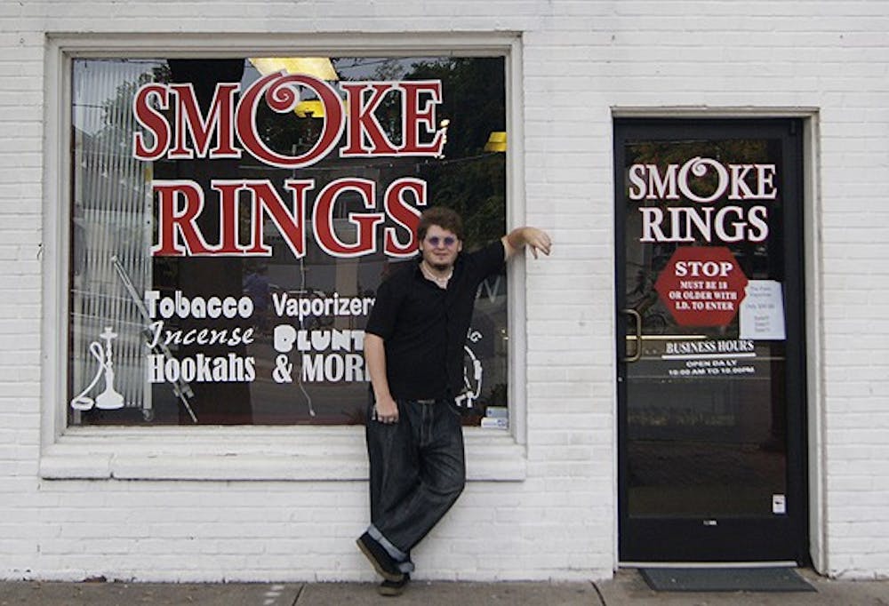 Larry Webster, known as "Crazy Larry" to his customers at the Smoke Rings smoke shop, has dreamed of working on Franklin St. since he was a kid.  He doesn't believe the county wide ban would affect the store's business terribly.