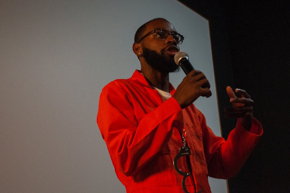 <p>Nick Courmon, the community engagement coordinator for Racist Roots, addresses the crowd after the film's screening at Chelsea Theater in Chapel Hill on Thursday, Aug. 18, 2022.</p>