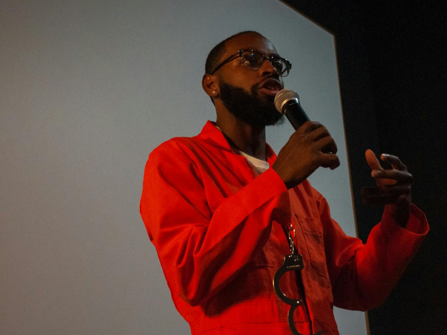Nick Courmon, the community engagement coordinator for Racist Roots, addresses the crowd after the film's screening at Chelsea Theater in Chapel Hill on Thursday, Aug. 18, 2022.