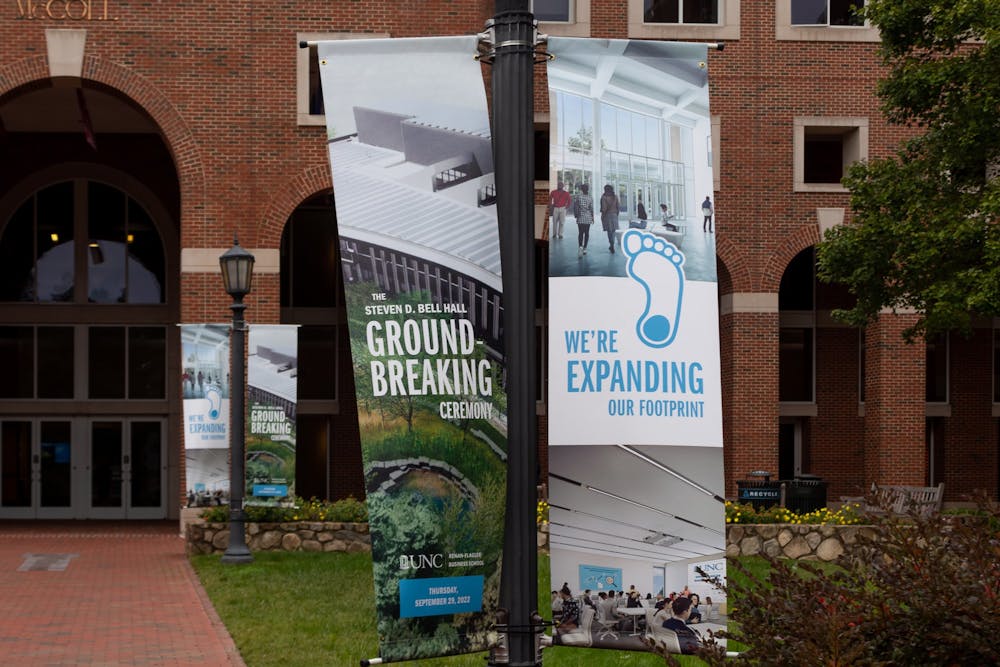 Banners promoting the Steven D. Bell Hall Groundbreaking Ceremony pictured outside of UNC Kenan-Flagler Business School on Monday, Oct. 3, 2022.
